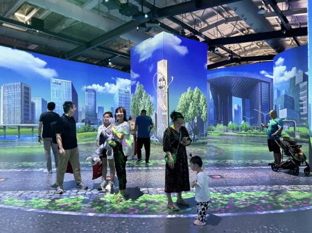 (miniature) Des visiteurs testent une ville virtuelle